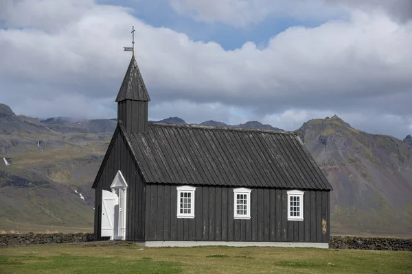 The Buir black church is one of 3 black churches in Iceland. They are black because the exterior wood is painted with pitch, just like the hull of a boat. This is to protect it from the harsh Icelandic elements.