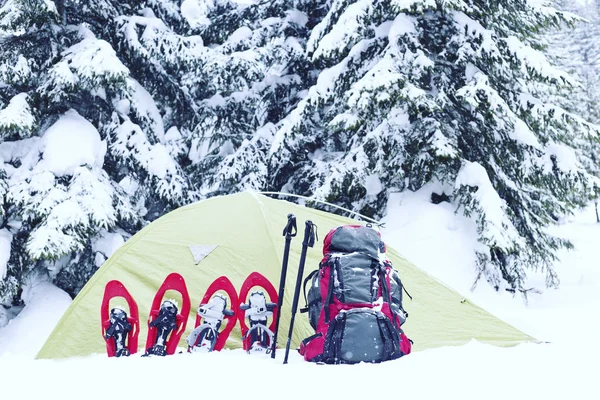 Winter hiking.Winter hiking in the mountains on snowshoes with a backpack and tent.