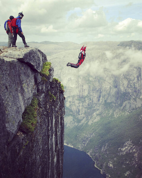 Rope jumping.Jump off a cliff into a canyon with a rope.