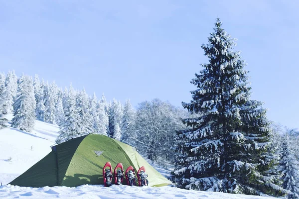 Winter hiking.Winter hiking in the mountains on snowshoes with a backpack and tent.