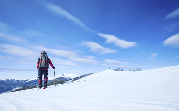 Winter hiking.Winter hiking in the mountains on snowshoes with a backpack and tent.