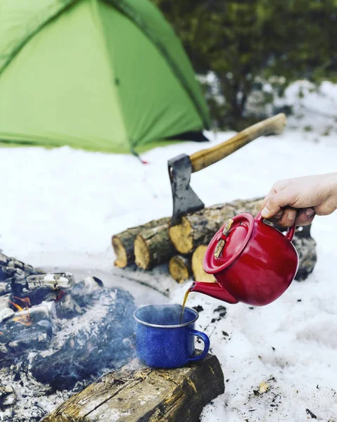 Cooking breakfast.Cooking breakfast on a fire in a tent camp.