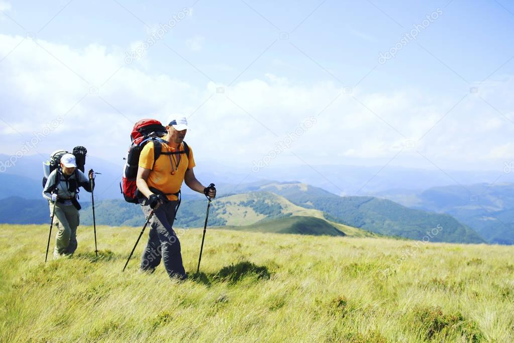 Summer hiking.Summer hiking in the mountains with a backpack and tent.