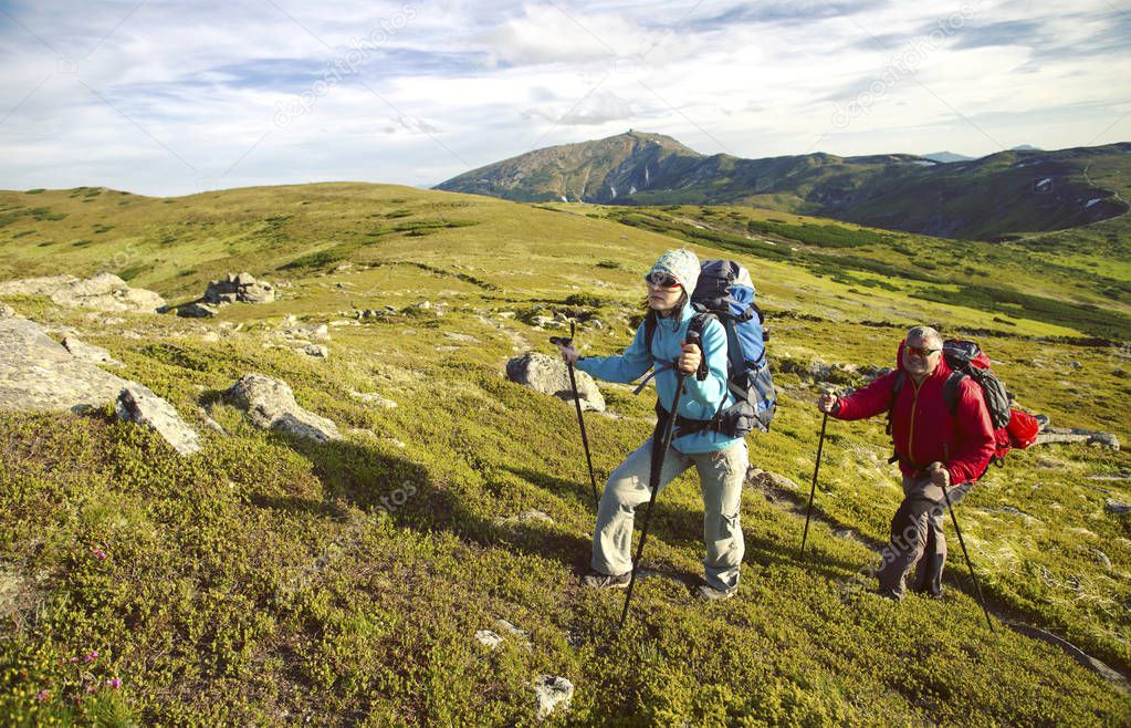 Summer hiking.Summer hiking in the mountains with a backpack and tent.