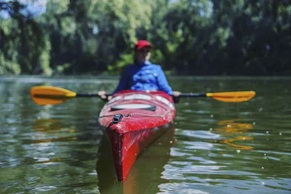 A girl rafts down the river on a kayak. — Stock Photo, Image