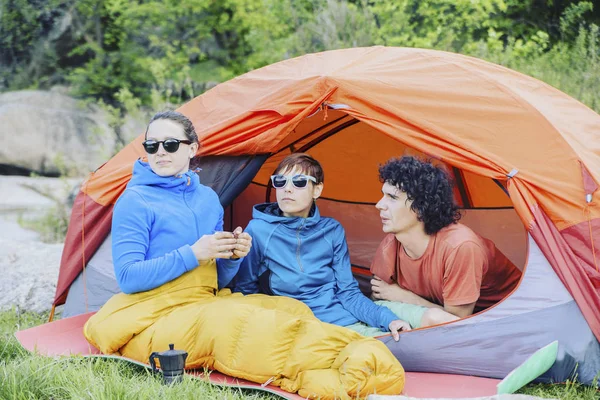 Group Of Friends Relaxing Outside Tents On Camping Holiday. — Stock Photo, Image