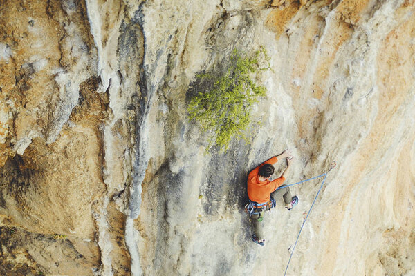 Rock-climbing in Turkey. The guy climbs on the route. Photo from