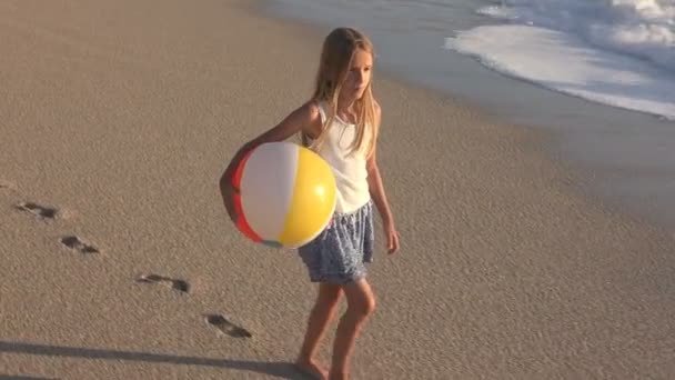 Child Playing on Beach at Sunset, Happy Kid Walking in Sea Waves Girl on Seaside — Stock Video