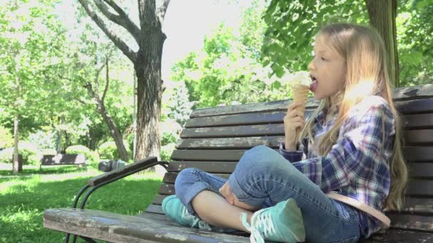 Kid Eating Ice Cream in Park, Child Relaxing Sitting on Bench Girl at Playground — 비디오