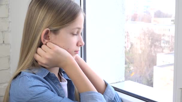 Sad Kid Looking on Window, Unhappy Child,  Bored Thoughtful Girl, Sadness on Teenager Face, Isolated People Quarantined at Home due to Coronavirus Crises — Stock Video