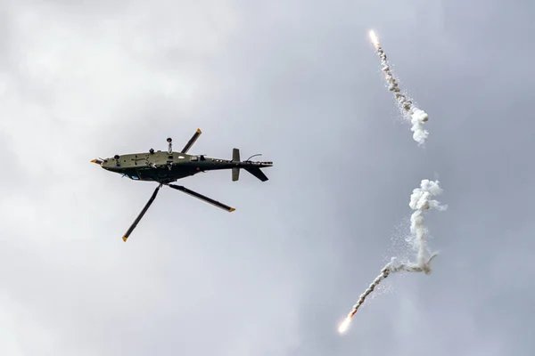 Helicopter Augusta A-109 and flares — Stock Photo, Image