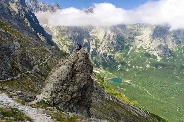 Happy trekking girl on the rock at High Tatras mountains, Slovak — Stock Photo, Image