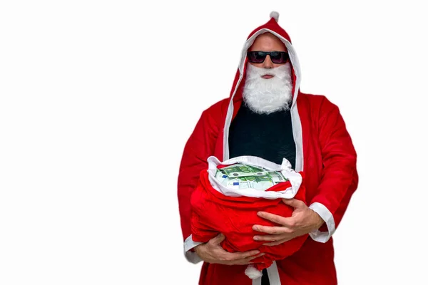 Święty Mikołaj z torbą pełną pieniędzy — Zdjęcie stockowe