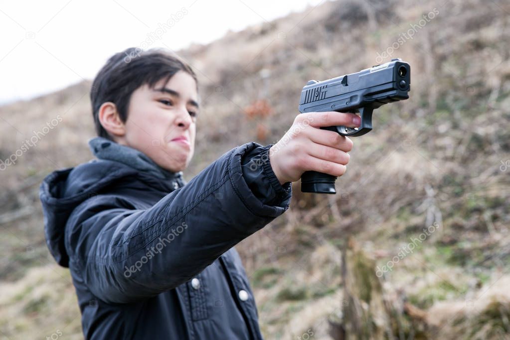 Angry boy with gun