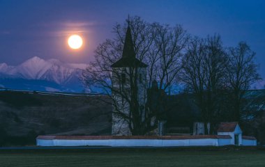 Full moon and lonely church at country clipart