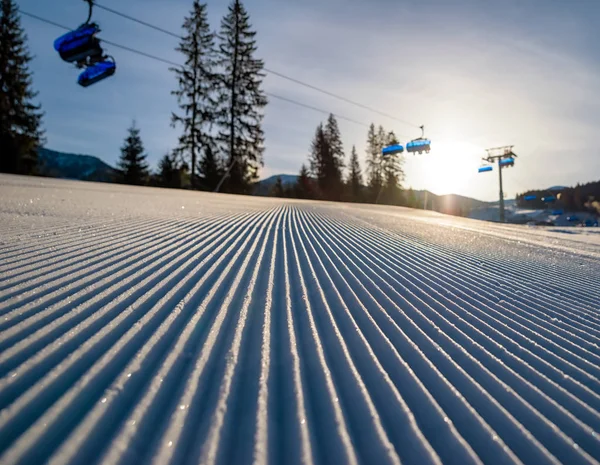 Fresh groomed snow and ski lift chair in resort Jasna, Slovakia — Stock Photo, Image
