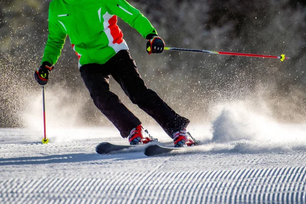 Skier on fresh groomed snow on slope — Stock Photo, Image