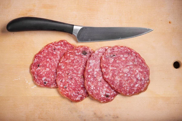 Salami on the desk — Stock Photo, Image