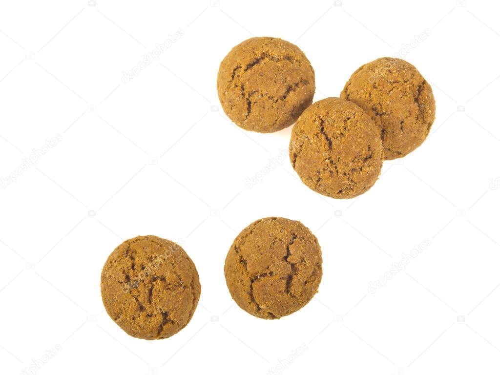Five Pepernoten cookies seen from above