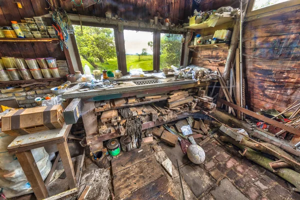 Very messy workbench of compulsive hoarder — Stock Photo, Image
