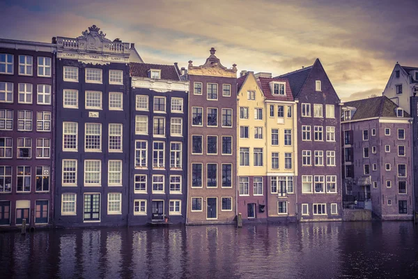 Canal houses Amsterdam damrak retro look — Zdjęcie stockowe