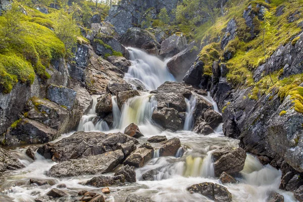 Waterfall with long exposure and blurred water flow Royalty Free Stock Images