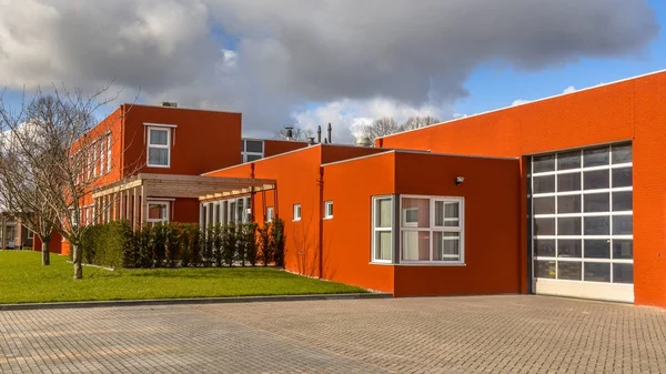 Red commercial building with warehouse — Stock Photo, Image