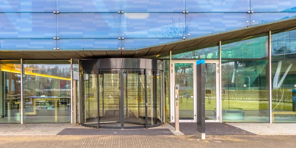 Academy entrance with revolving door — Stock Photo, Image