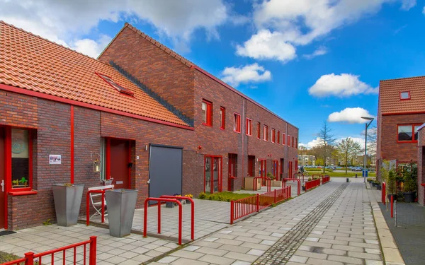 Modern street with red brick houses — Stock Photo, Image