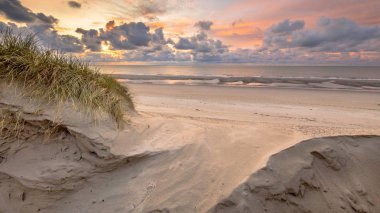 Sunset View on North Sea and Canal fom dunes in Zeeland, Netherlands clipart
