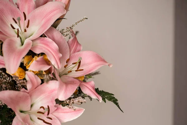 Pink lilies bouquet. Pink blossoming flowers texture. Soft pastel light natural spring background.