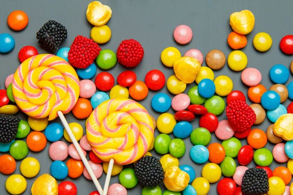 Colorful candies on wooden background — Stock Photo, Image