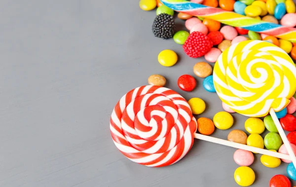 Colorful candies on wooden table background. Top view — Stock Photo, Image
