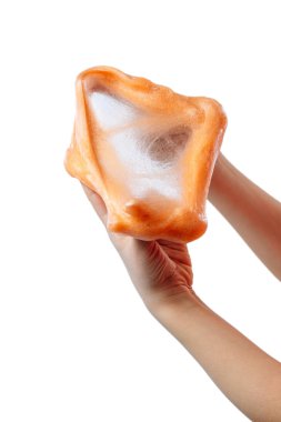 Çocuklar için bir oyuncak sümük ve beyaz arka planda akan sıvı.