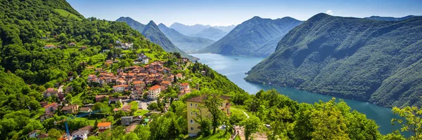 Lugano staden och den vackra blå sjön — Stockfoto