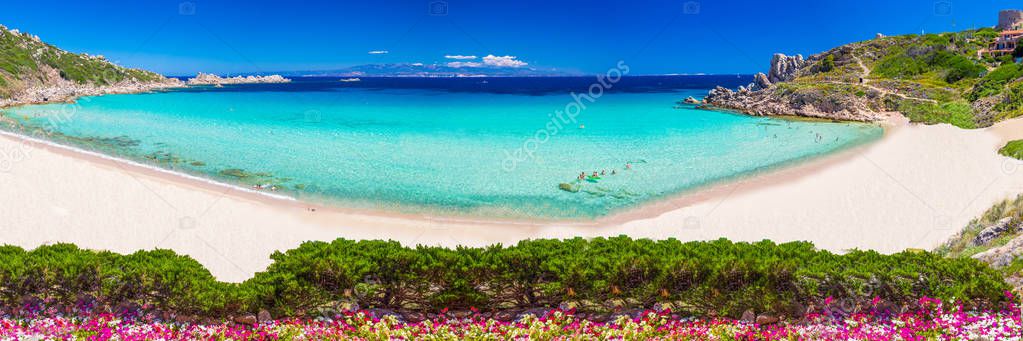 Spiaggia di Rena Bianca beach with red rocks and azure clear water, Santa Terasa Gallura, Sardinia, Italy