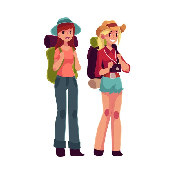 Dos chicas guapas viajando, haciendo autostop con mochilas y cámara — Vector de stock