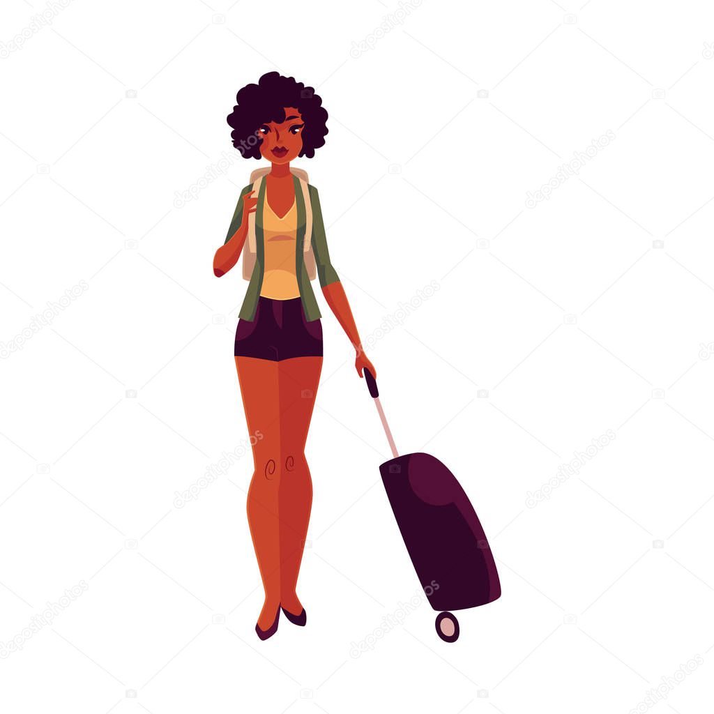 Pretty African American girl, woman traveler with backpack and suitcase