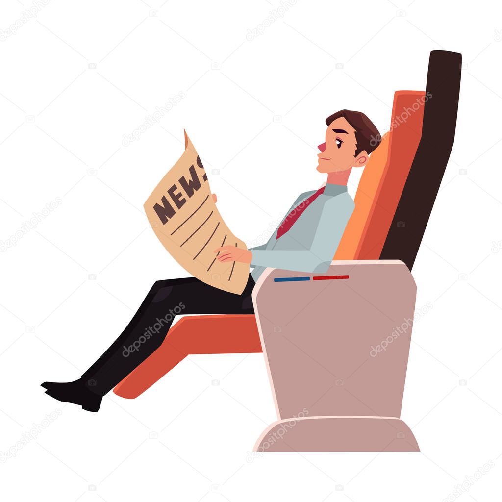 Businessman reading newspaper in business class airplane seat