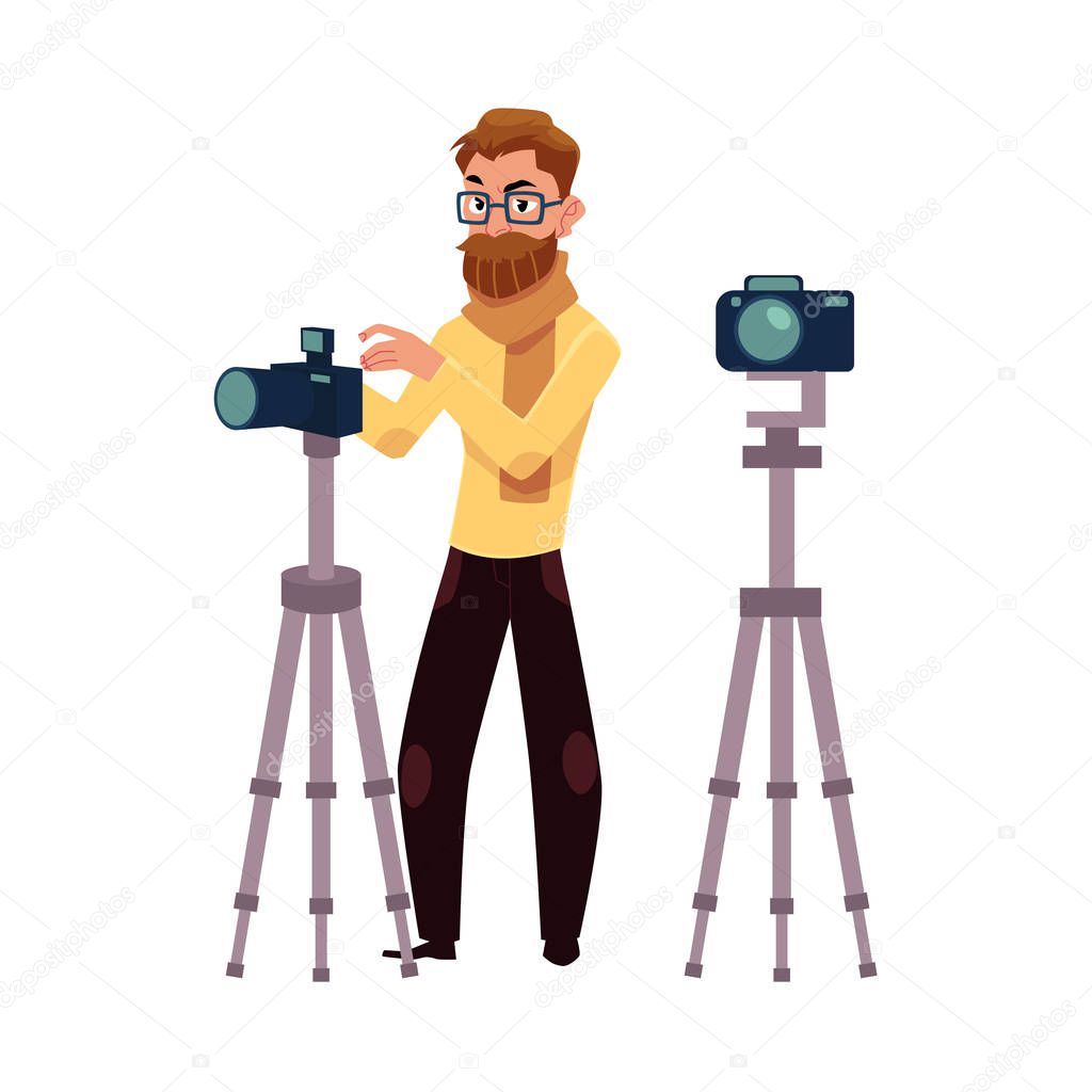 Photographer taking pictures, shooting in studio, digital camera and tripod