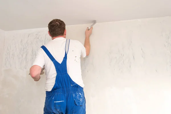 Hands plasterer at work Stock Picture