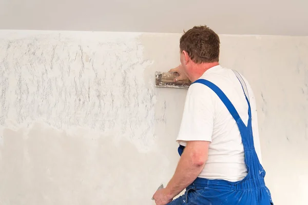 Hands plasterer at work Stock Picture