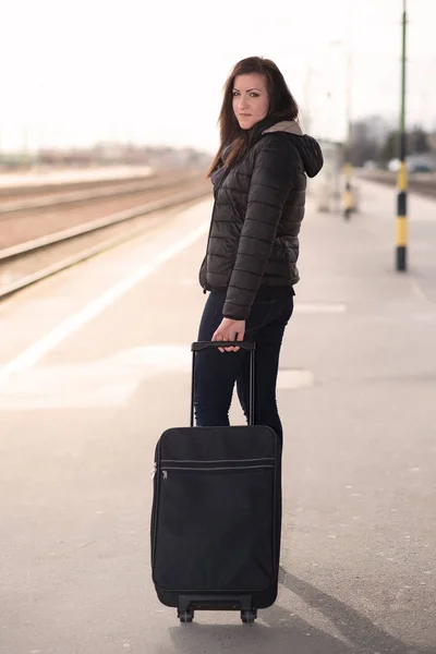 Portrait of a traveling student woman walking with bag