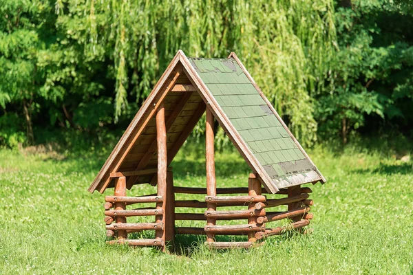 Wooden house in the park — Stock Photo, Image