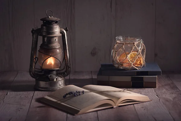 Old Antique Book Opened Burning Kerosene Lamp Wooden Table — Stock Photo, Image