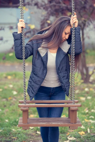 Sad woman in the park — Stock Photo, Image