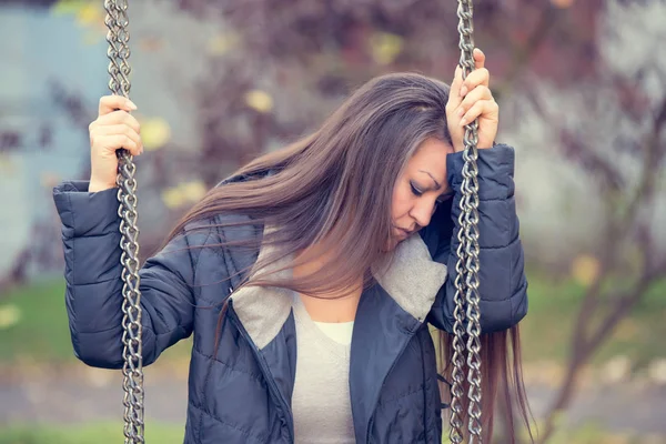 Sad woman in the park — Stock Photo, Image