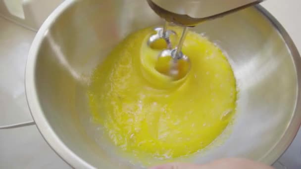 Female Hand Beating Eggs Hand Mixer — Stock Video