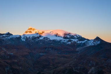 Sunset light over the scenics Monte Rosa glaciers and the Klein Matterhorn or Piccolo Cervino summit (3881 m), italian side, Valle d'Aosta.