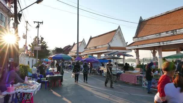 Nong Khai, Thailand - December, 2016: delicious food stall and roaming people in the colorful weekend street market at Nong Khai, Thailand. — Stock Video